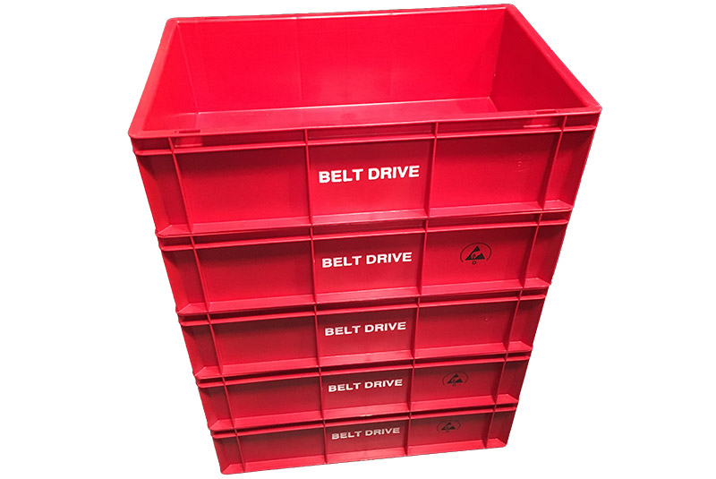 A stack of crates with hot foil printed branding.