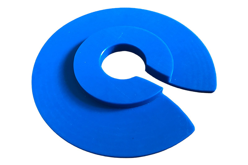 A plastic component used in the materials handling industry that has been cut to shape with a CNC machine.