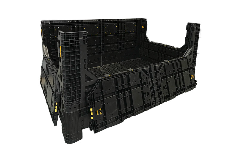 A plastic storage box with drop down doors for materials handling.