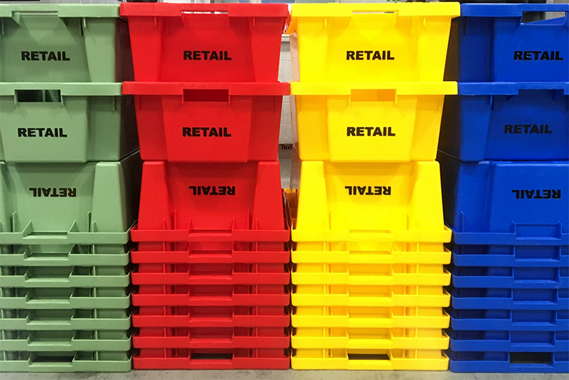 Plastic boxes with text printed on their sides using the hot foiling method.